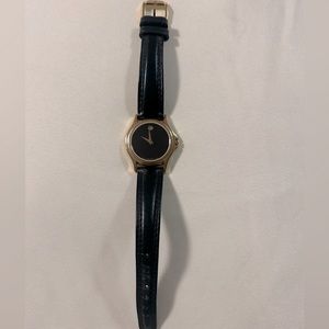 Movado black and gold watch